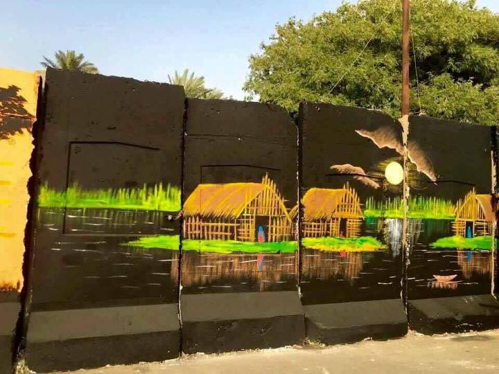 بالصور.. عراقيون يحولون الكتل الخرسانية الى لوحات فنية