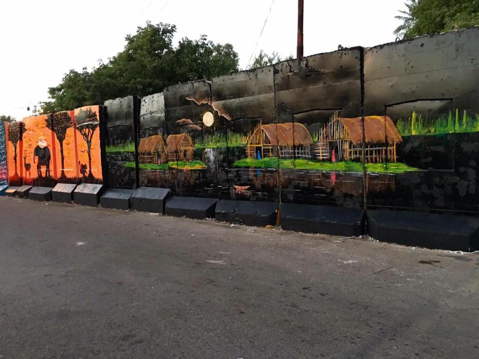 بالصور.. عراقيون يحولون الكتل الخرسانية الى لوحات فنية