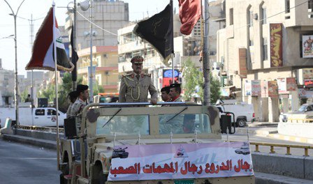 بالصور.. استعراض عسكري في قلب بغداد