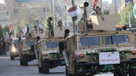 بالصور.. استعراض عسكري في قلب بغداد