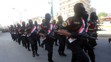 بالصور.. استعراض عسكري في قلب بغداد