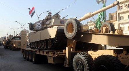 بالصور.. استعراض عسكري في قلب بغداد