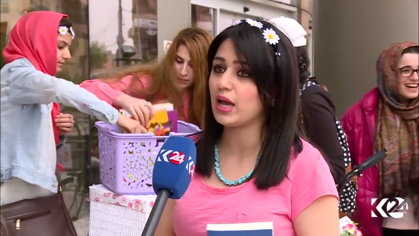 Kurdish women voluntarily deliver books on bikes