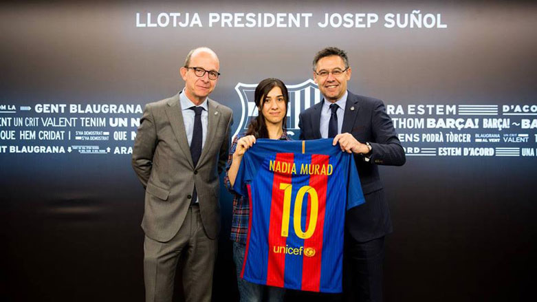 Nadia Murad meets the President of Barcelona FC Josep Maria Bartomeu and Vice-president Jordi Cardoneri Casaus, receiving her Barcelona Football Club shirt, Jan. 12, 2017. (Photo: Nadia Murad Facebook Account)