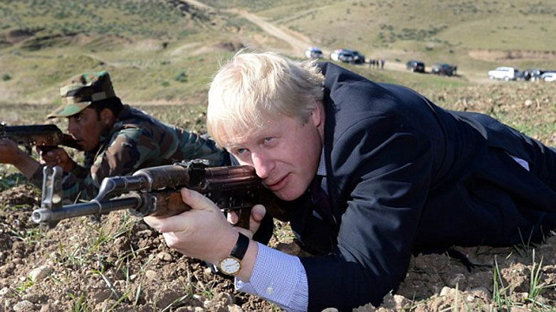 UK Secretary of State Foreign and Commonwealth Affairs Boris Johnson holds an AK-47 during a visit to Erbil, Kurdistan Region, January 2015. (Photo: Archive)