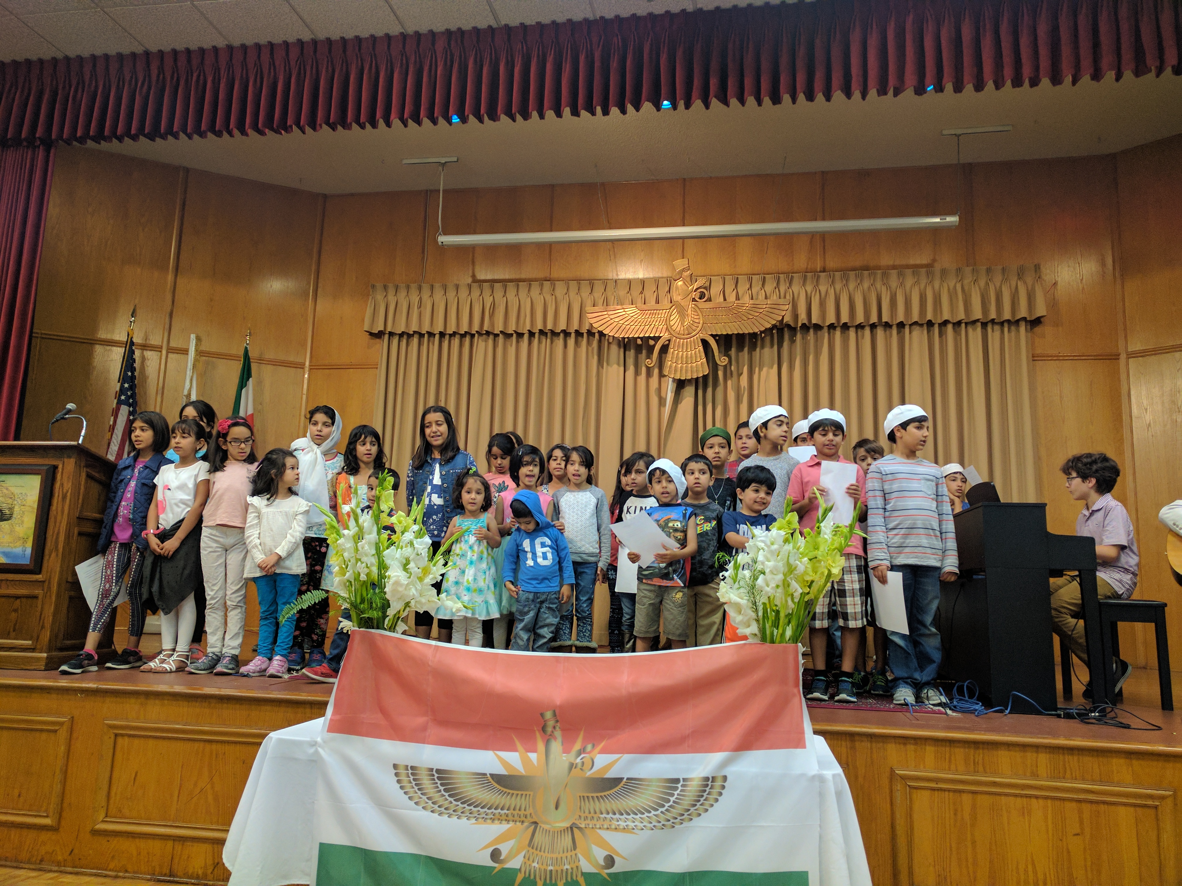 American Zoroastrians children of mosty Iranian descent sing a prayer at the beginning of a ceremony honoring the representatives of Kurdistan Regional Government. (Photo: Kurdistan24/Ava Homa) 