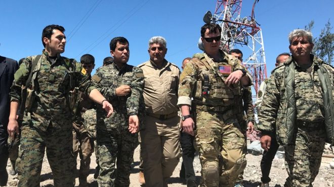 US military officials accompanied by Kurdish fighters visited YPG’s bombed headquarters near the town of Derik, in Syrian Kurdistan. (Photo: Reuters)