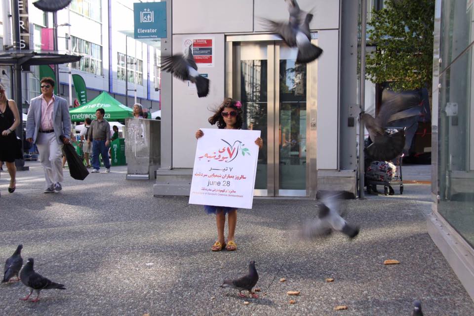 A young Kurdish-Canadian girl marks Sardasht tragedy in Vancouver. (Photo: Facebook)