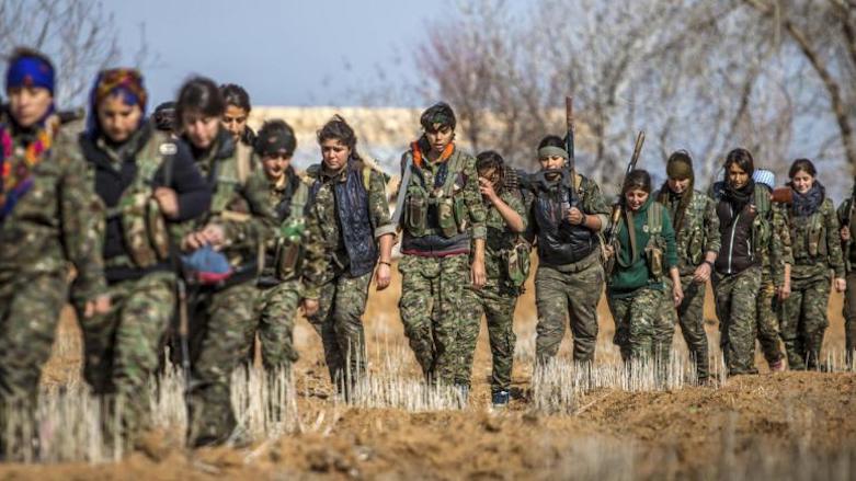 Female fighters of the Kurdish People's Protection Units (YPG) carry their weapons as they walk in the western countryside of the town of Serekaniye, Syrian Kurdistan, January 25, 2015. (Photo: Reuters)