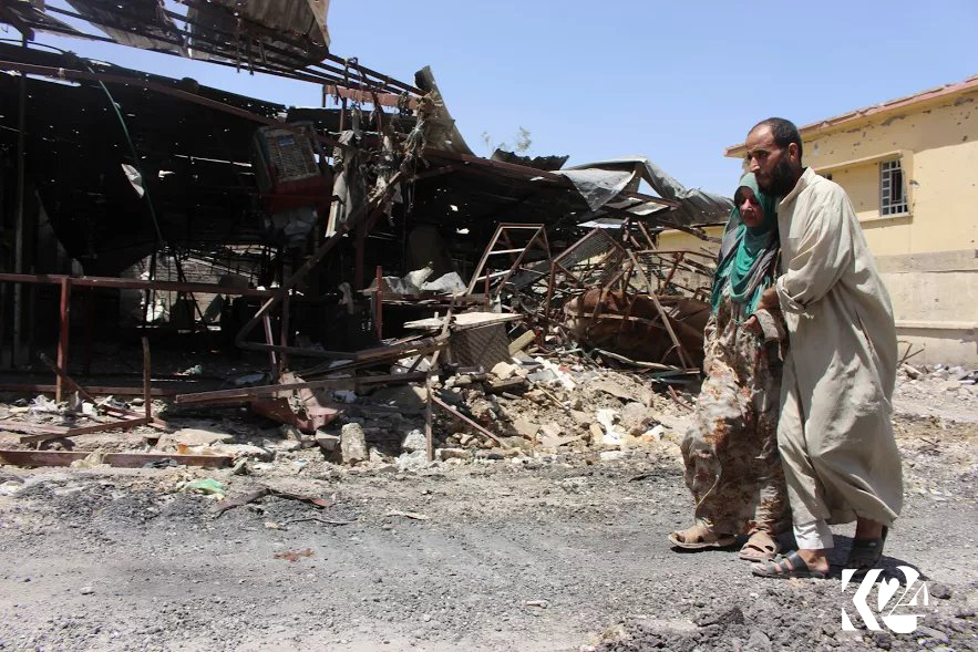 بە وێنە... شەڕ و وێرانكاری گەڕەكێكی مووسڵ