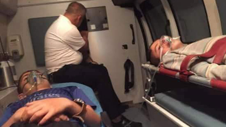 Two children being transferred to a nearby hospital in Duhok after a gas leak broke out at an oilfield, July 8, 2018. (Photo: Social Media)