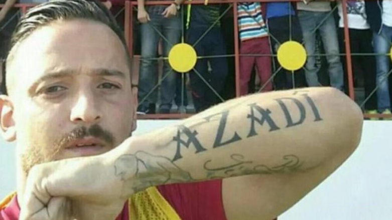 Deniz Naki shows his arm tattoo reading “Azadi” which means freedom in Kurdish. (Photo: Naki)