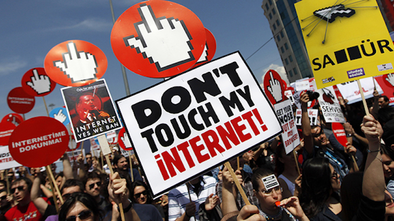 Demonstrators hold placards with some featuring a picture of Turkey's President Recep Tayyip Erdogan during a protest against Internet censorship in Istanbul, May 15, 2011. (Photo: Reuters)