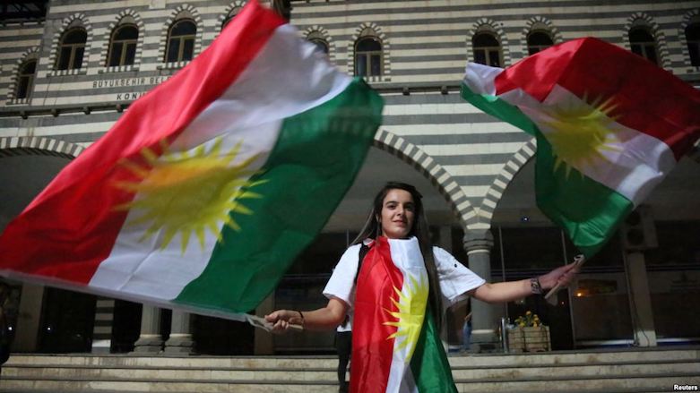 Young woman in Diyarbakir waves Kurdistan flags in support of Kurdistan Region's Monday referendum on independence from Iraq, Sept 25, 2107. (Photo: Reuters)