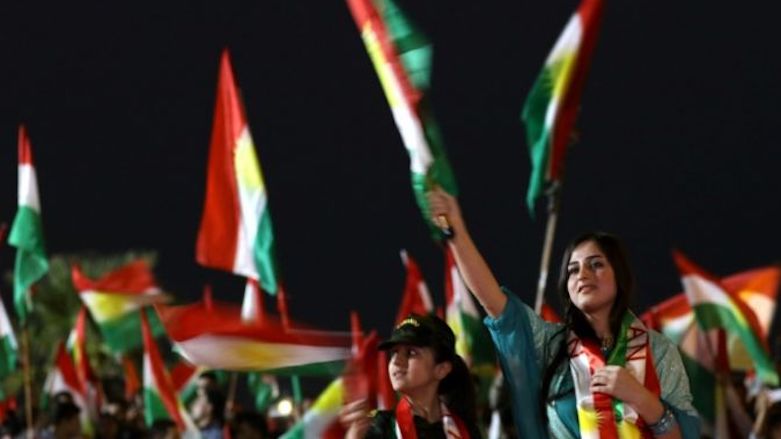 People wave flags in celebration of Kurdistan Region's upcoming Monday referendum on secession from Iraq, Erbil, Sept 20, 2017. (Photo: AFP)
