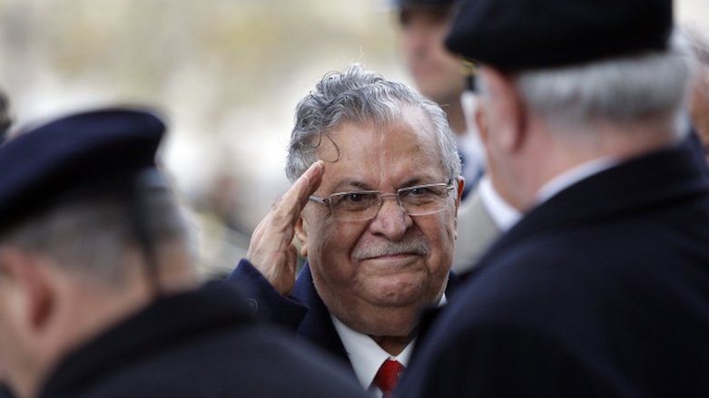 Former Kurdish guerrilla leader and a then Iraqi President Jalal Talabani salutes unidentified war veterans at the Tomb of the Unknown soldier under the Arc de Triomphe, in Paris, during his first state visit to France, Nov. 17, 2009. (Photo: Associated Press)