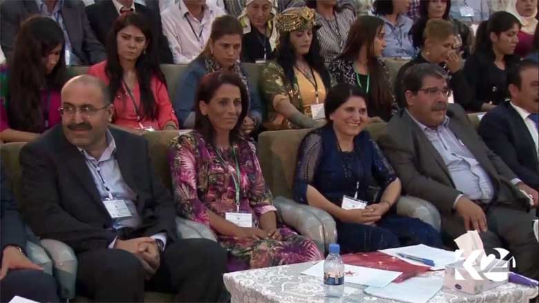The new PYD co-chairs Shahoz Hasan and Aysha Hisso [L] are sitting with the previous co-chairs Asya Abdalla and Saleh Muslim [R] at the PYD 7th congress in Rmeilan town, Rojava, Syria, September 27, 2017. (Photo: Kurdistan 24)