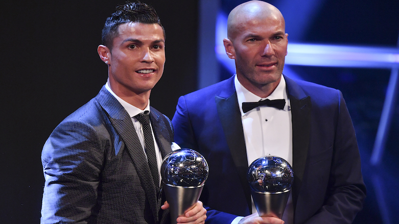 Real Madrid's French coach Zinedine Zidane (R) stands with his trophy for winning The Best FIFA Men's Coach of 2017 Award alongside Real Madrid and Portugal forward Cristiano Ronaldo, with his trophy for winning The Best FIFA Men's Player of 2017 Award during The Best FIFA Football Awards ceremony, on Oct. 23, 2017 in London.  (Photo: AFP/Ben Stansall)