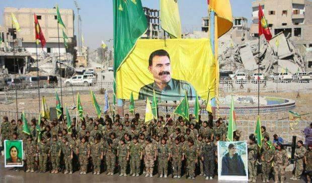 The Syrian all-female forces YPJ raising a a huge banner of the jailed Kurdish leader Abdullah Ocalan in a ceremony in the main square of Raqqa city after liberation, Raqqa, Syria, October 19, 2017. (Photo: SDF media office)