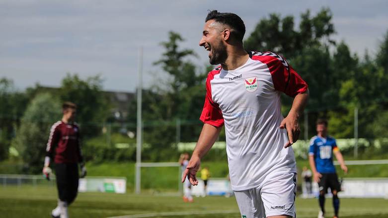 SV Azadi Lübeck player Karwan Rashid celebrates after scoring a goal for his team. (Photo: Ulf-Kersten Neelsen)