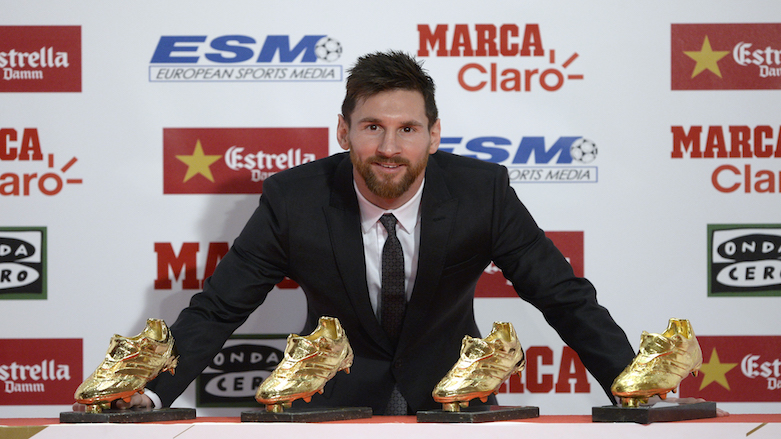 Barcelona's Argentinian forward Lionel Messi poses with his four Golden Shoe awards after receiving the 2017 European Golden Shoe honoring the year's leading goalscorer during a ceremony at the Antigua Fabrica Estrella Damm in Barcelona on Nov. 24, 2017.  (Photo: AFP/Josep Lago)