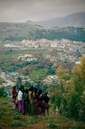 Revelers gathering to watch the Newroz festivities at night.