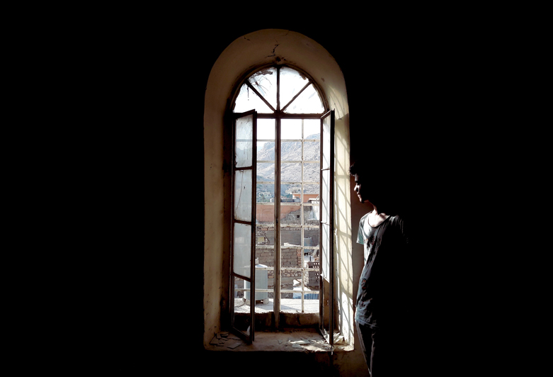The abandoned fort has beautiful architectural details such as arched doorways and windows.