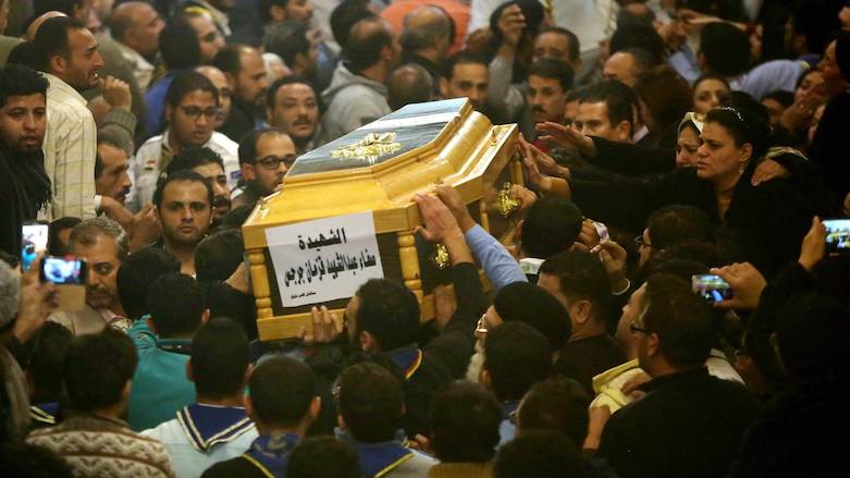 People mourn around a casket of a female victim during the funeral for victims of an attack at a church in Helwan, Cairo on Dec. 29, 2017. (Photo: Associated Press/Ayman Aref)