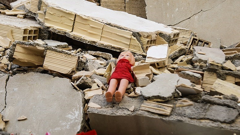 A child's toy sits atop rubble in the aftermath of the devastating earthquake that hit the border areas of the Kurdistan Region and Iranian Kurdistan (Rojhilat), Nov. 12, 2017. (Photo: Archive)