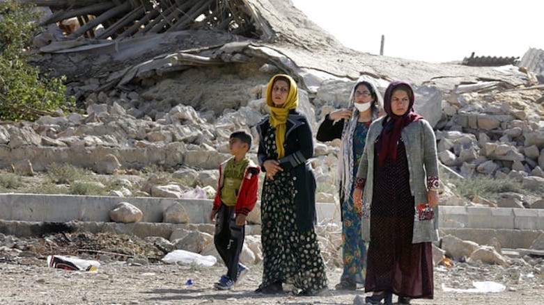 Kurds stare at the cameras with a dazed look. (Photo: AFP)