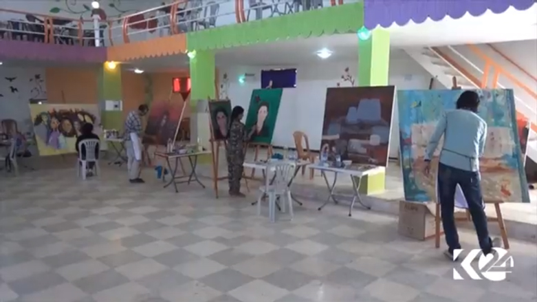 كوباني بريشة الفنانين في معرض بمشاركة كوردية واسعة