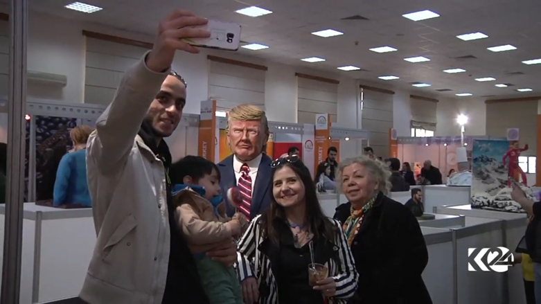 بالصور.. ترامب وميركل بمعرض حلويات بتركيا