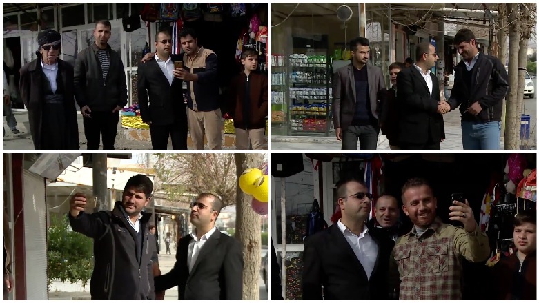 People stop to greet and take selfies with Rizgar Kakarosh in Taq Taq, Erbil, Kurdistan Region. (Photo: Kurdistan 24)
