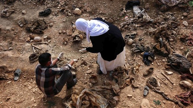 Locals search a mass grave for the remains of their family members. (Photo: Archive)