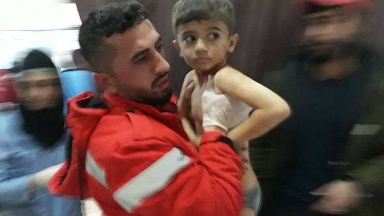 Medical workers at a local hospital rush a child the Turkish attacks wounded, Afrin, Syrian Kurdistan, Feb. 19, 2018. (Photo: Afrin Media Center)
