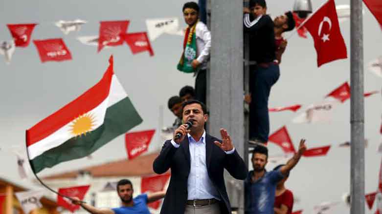A file photo of the now-imprisoned co-leader of Turkey's pro-Kurdish Peoples' Democratic Party (HDP) Selahattin Demirtas with a flag of Kurdistan in the background during an election rally in 2015, Istanbul, Turkey. (Photo: Reuters)