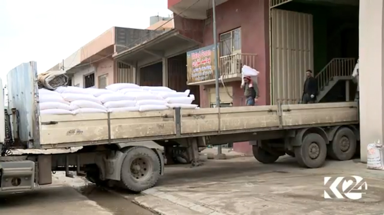 A truck is loaded with bags of wheat from a warehouse in the Kurdistan Region. (Photo: Kurdistan 24)