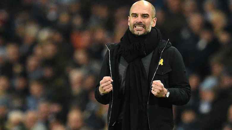 Pep Guardiola wears the yellow ribbon during a match. (Photo: AFP)