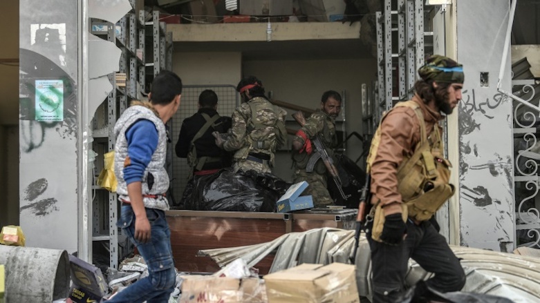 Turkish-led Syrian Arab fighters loot shops after capturing the Kurdish enclave of Afrin in Syrian Kurdistan from the US-armed Kurdish People's Protection Units (YPG), March 18, 2018. (Photo: AFP)