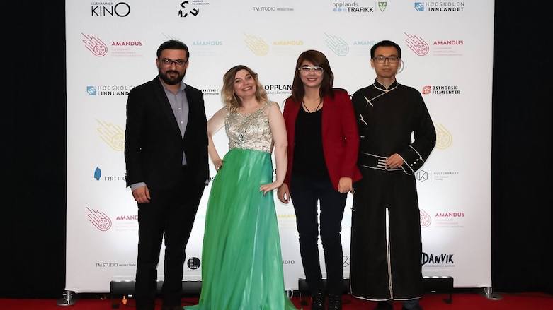 Shamal Sabri (left) and Bina Qeredaxi (third from left) pose for a photo with Amandus Director Linda Steinhoff and Chinese cultural activist Li Dan at the Amandus international film festival in Norway. (Photo: Duhok IFF)
