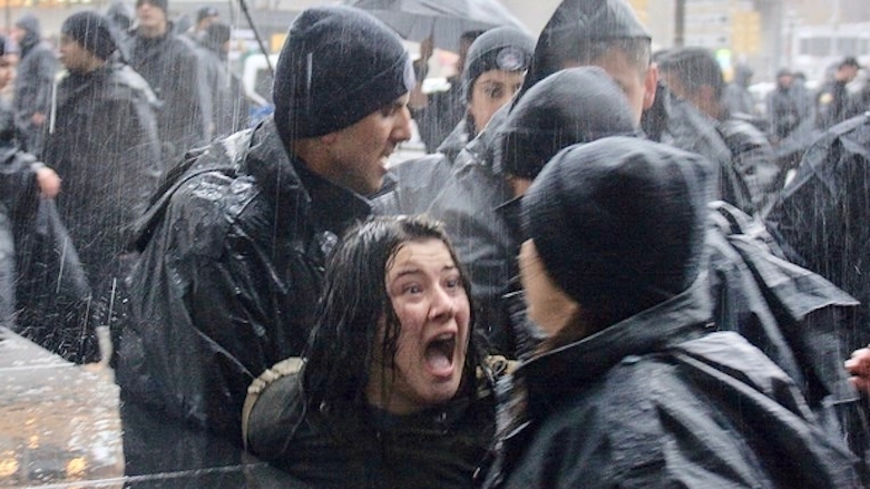 A woman shouts at Turkish riot police as they detain her during a rally for women's rights in Ankara, March 4, 2018. (Photo: AFP)