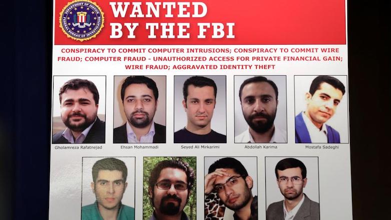 Pictures of nine Iranians charged with conducting a massive cyber theft campaign are seen on display during Deputy Attorney General Rod Rosenstein's news conference at the Justice Department in Washington, US, March 23, 2018. (Photo: Reuters)