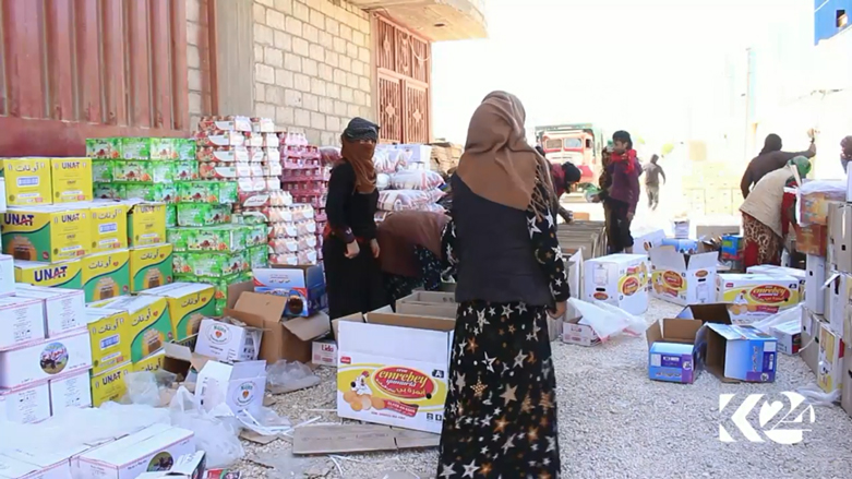 Members of the Kurdistan Red Crescent prepare boxes of aid to be sent to the displaced persons from Afrin, March 26, 2018. (Photo: Kurdistan 24)