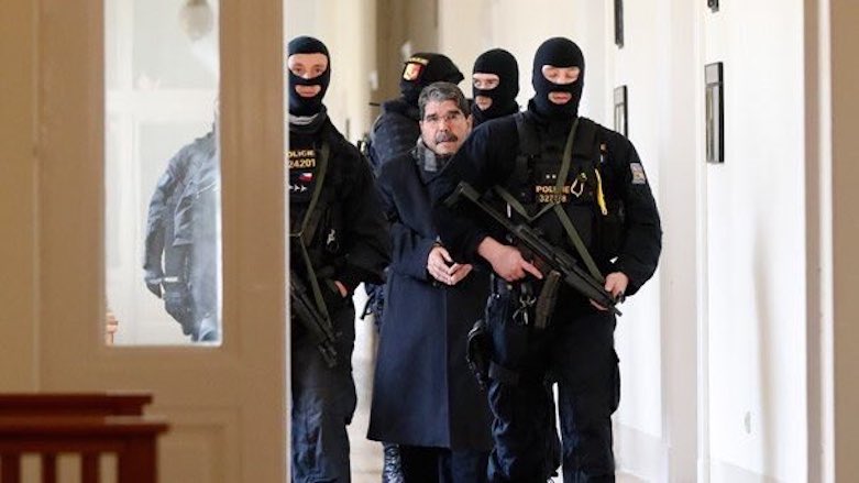 Former Syrian Kurdish leader Salih Muslim is escorted outside of a courthouse following his release on bail, Feb. 27, 2018. (Photo: Social Media)