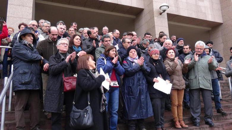 A group supporting the academics under fire gather in front of a courthouse to file lawsuits against themselves after signing the peace petition in protest of the government's contempt, Izmir, Turkey, January 2016. (Photo: DHA)