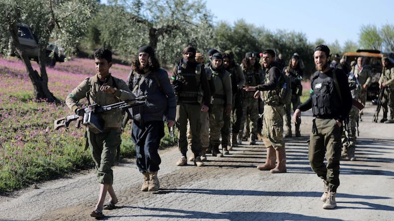 Turkey-backed Free Syrian Army fighters walk together during the Turkish invasion of Afrin, north of Afrin, Syrian Kurdistan, March 17, 2018. (Photo: Reuters)