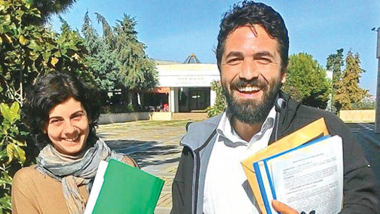 Son of a martyr: Associate professor of politics Ulas Bayraktar (R) whose soldier father was one of Turkey's first casualties in the war with the PKK was dismissed from Mersin University for urging peace with Kurdish rebels. (Photo: DHA)