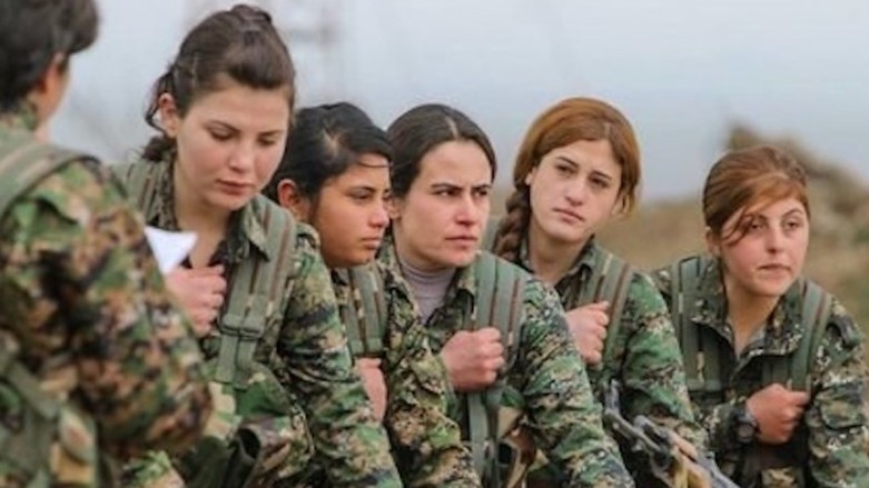 US-allied Kurdish fighters take an oath during a graduation ceremony from military training. (Photo: YPG)