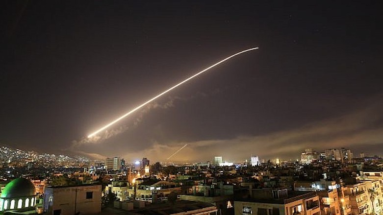 An airstrike is photographed over the Damascus skies. (Photo: Associated Press)