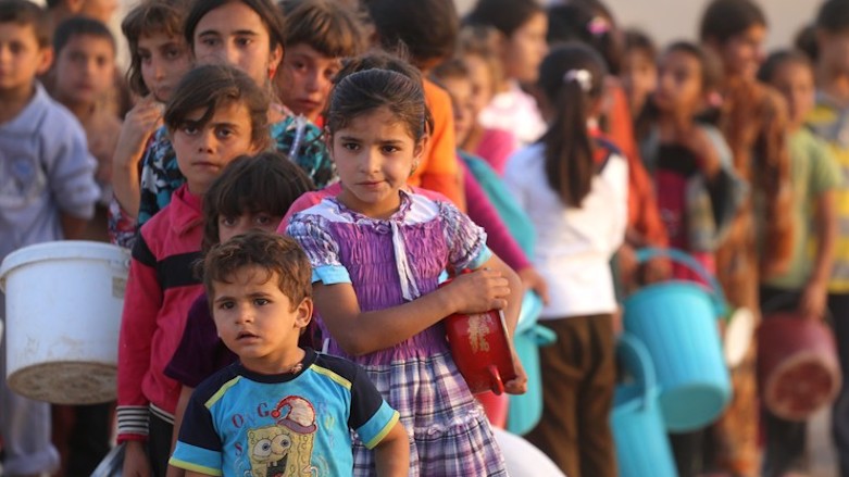 Displaced children are photographed at a refugee camp in Iraq. (Photo: Archive)